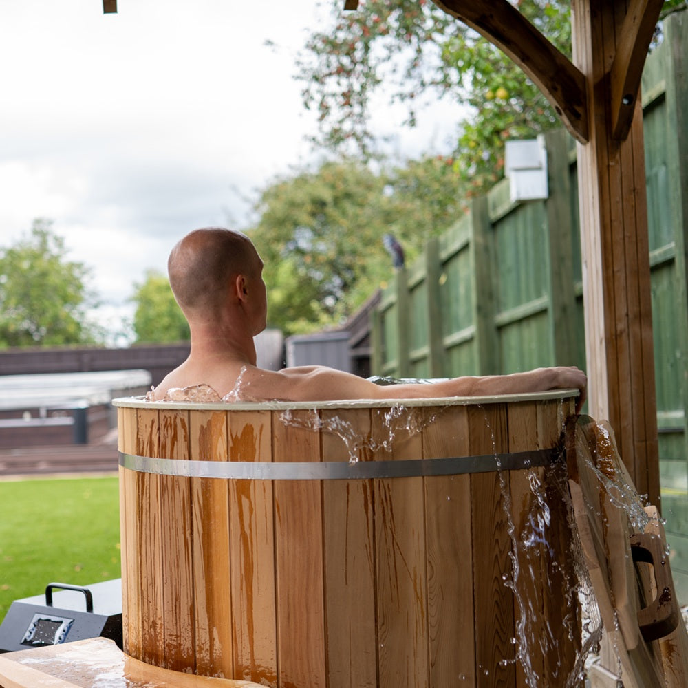 WIDO cedar ice bath installed in a garden or patio setting