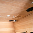 Inside view of WIDO infrared sauna showing lights and speakers